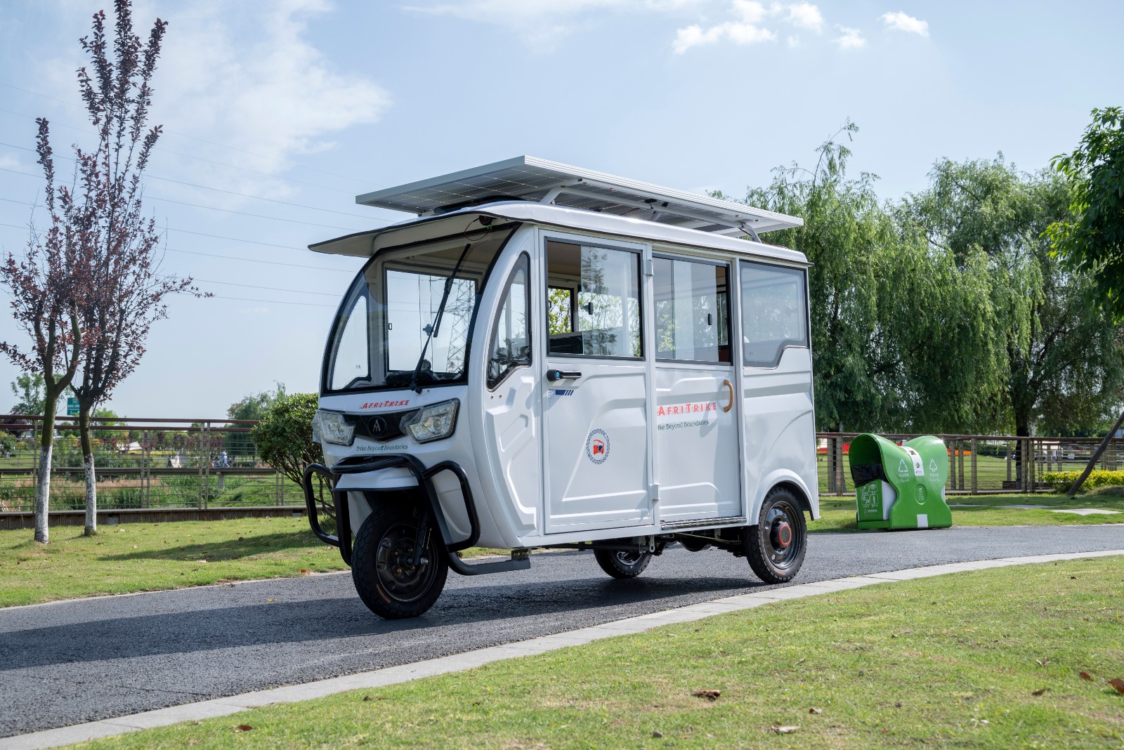 Afritrike solar powered electric tricycle with a red frame
